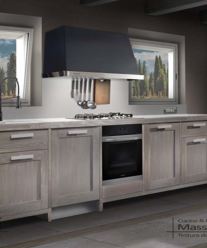 Cucina a banco con colonne portanti, ante, cassetti, forno e lavastoviglie, costruita su richiesta, personalizzabile.