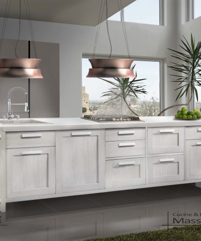 Isola cucina con ante, cassetti e cestoni, elemento importante costruito artigianalmente per cucine contemporanee.