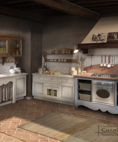 Cucina in legno massello atmosfera country in legno laccato vintage scrostato e consumato.